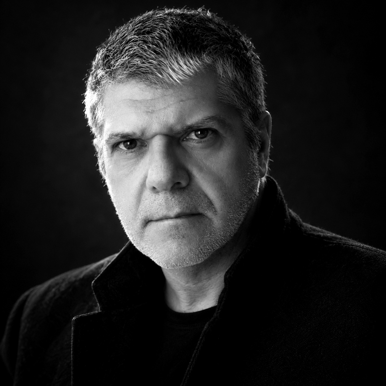 Black-and-white portrait of Cristiano Maiello wearing a dark coat